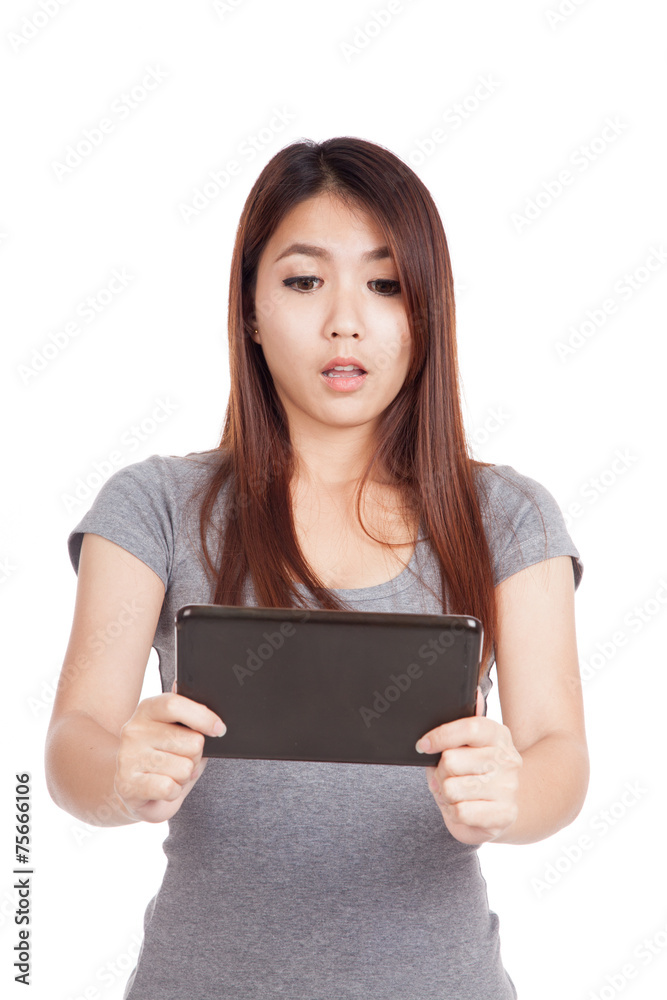 Young Asian woman shock with tablet pc Young Asian woman shock with tablet pc