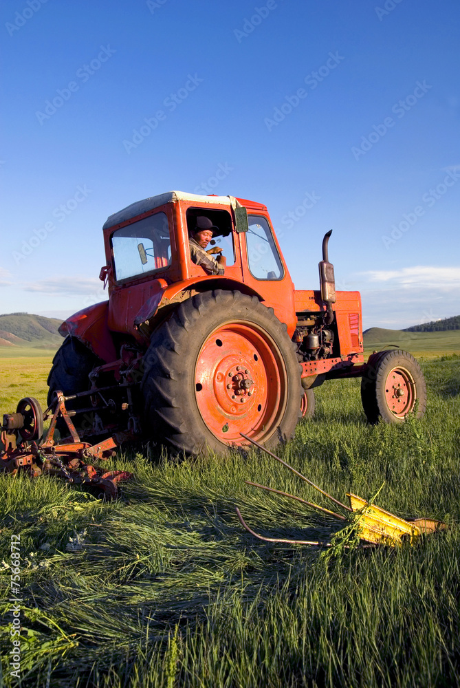Mongolian Farmer Driving Tractor Field Sky Concept Mongolian Farmer Driving Tractor Field Sky Concept