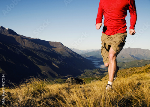 Man Jogging In A Beautiful Mountain Scenic