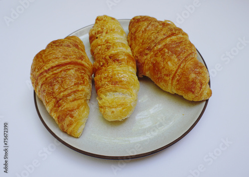 Croissants on the plate isolated