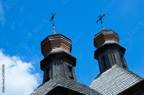coupolas of old wooden church photo