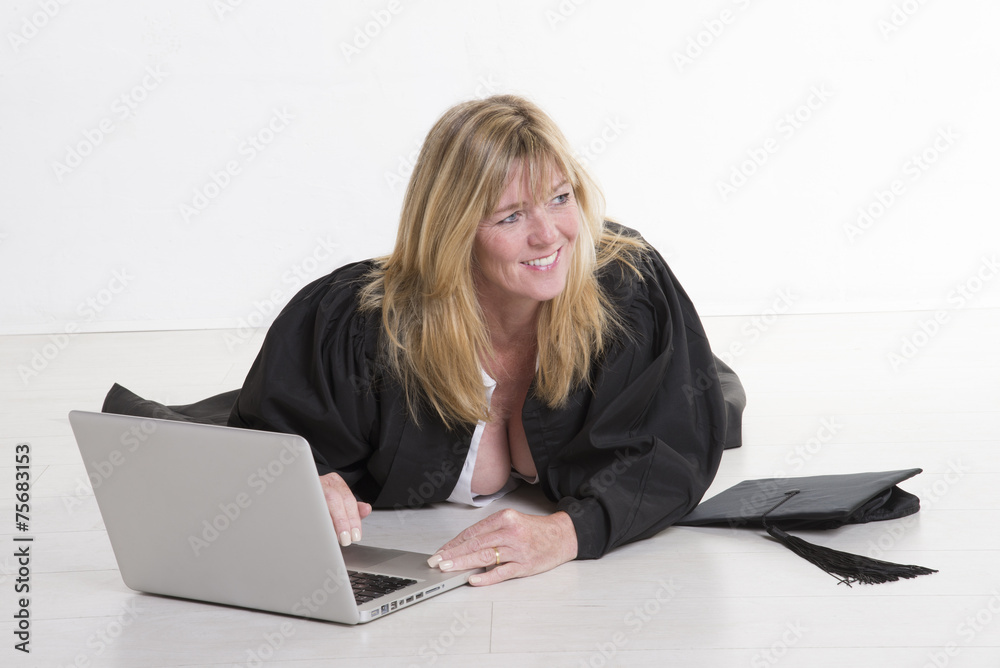 Mature university student using laptop computer Mature university student using laptop computer