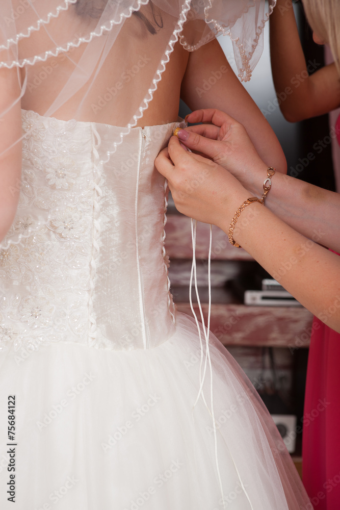 fastening detail of the dress from the bride