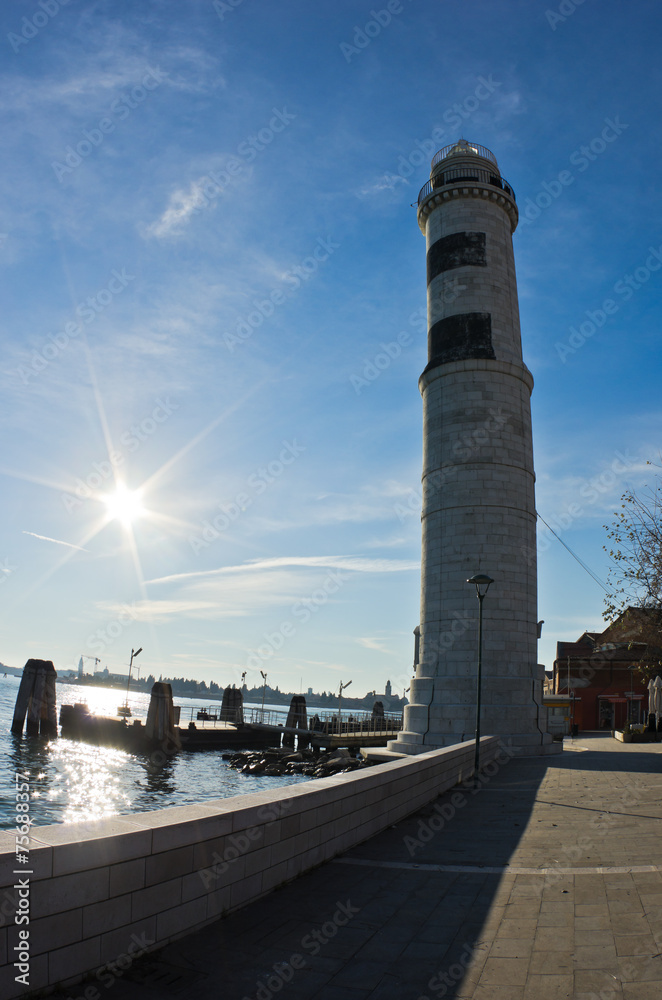 Lighthouse and pier at Murano island in Venice