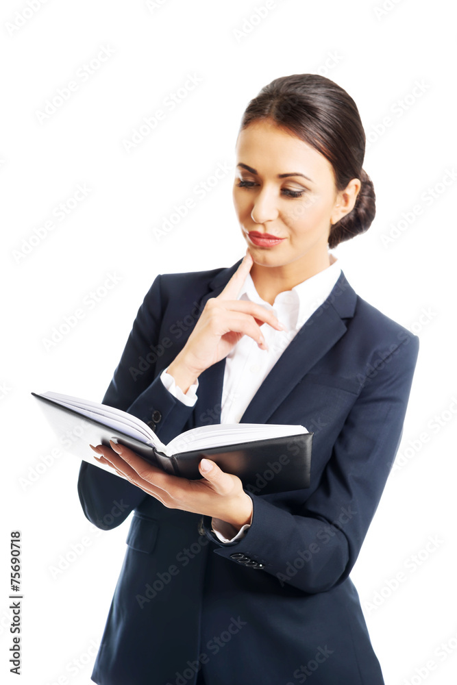 Portrait of businesswoman reading her notes Portrait of businesswoman reading her notes