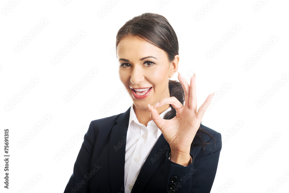 Businesswoman showing perfect sign Businesswoman showing perfect sign