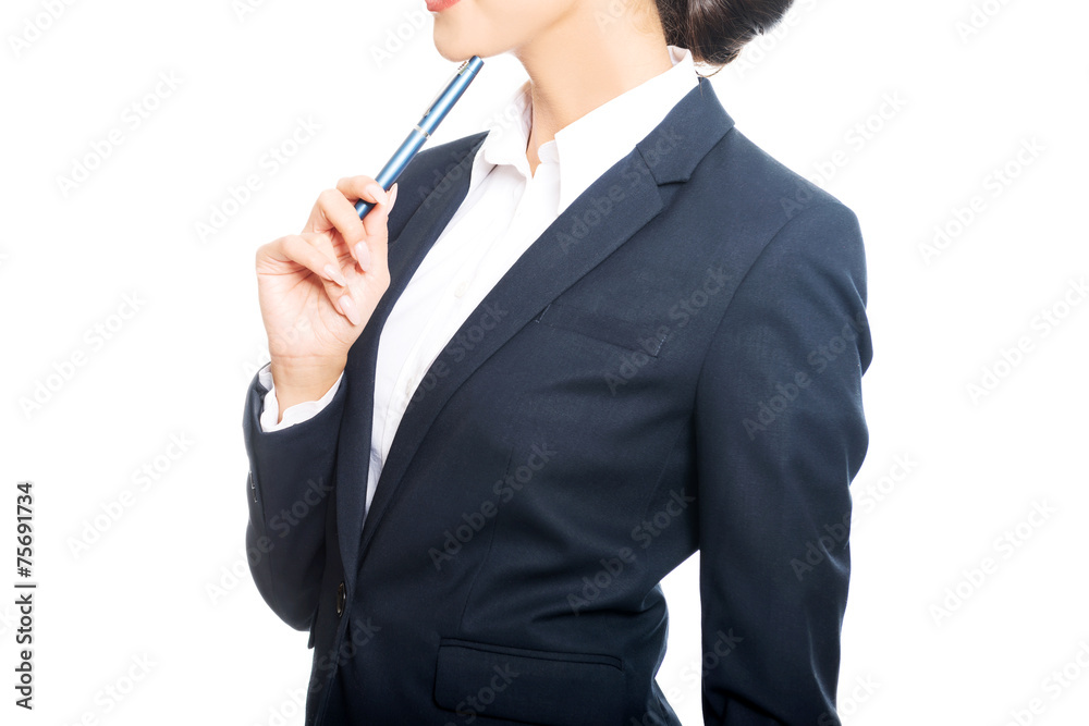 Portrait of businesswoman holding pen under chin Portrait of businesswoman holding pen under chin