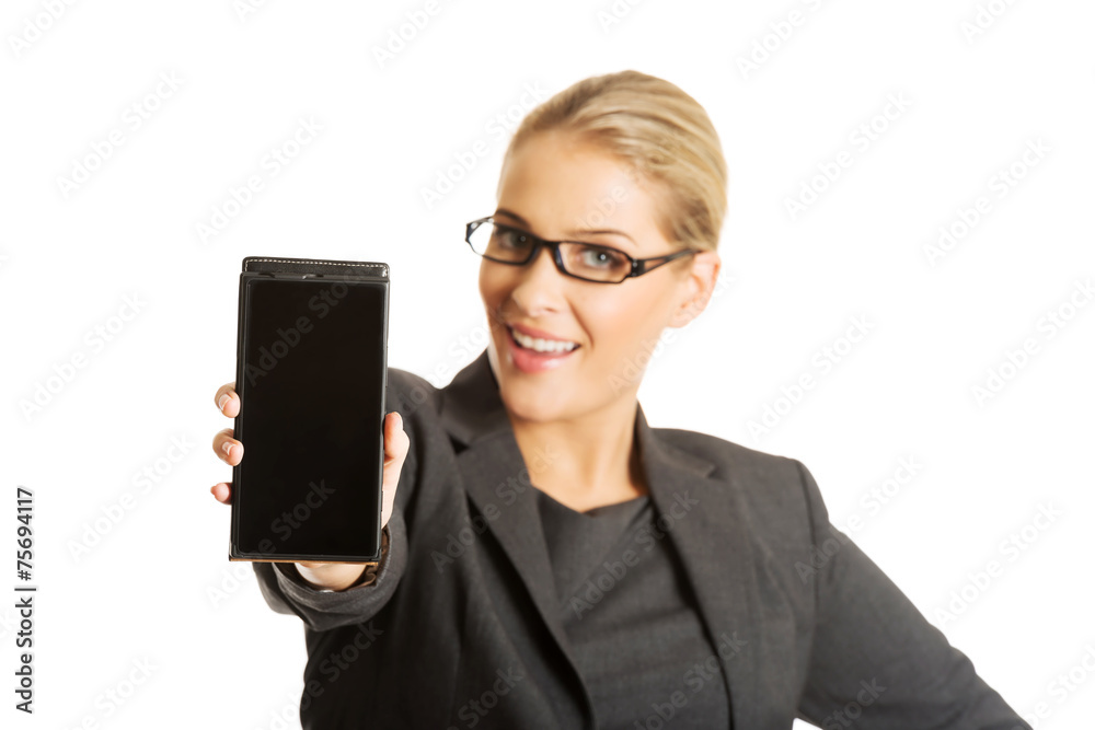 Businesswoman presenting mobile phone Businesswoman presenting mobile phone
