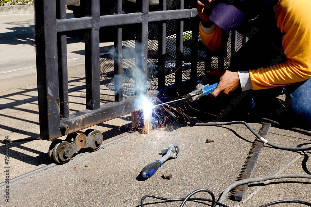Welder making a fence roller Stock Photo Adobe Stock