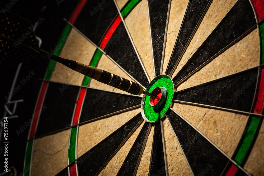 Dart in bull's eye close up Dart in bull's eye close up