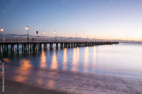Beautiful colorful Sunrise on the pier at the seaside © R_Szatkowski