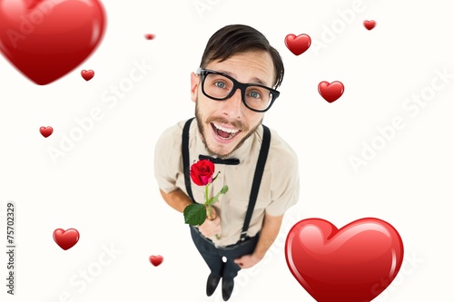 Composite image of geeky lovesick hipster holding rose
