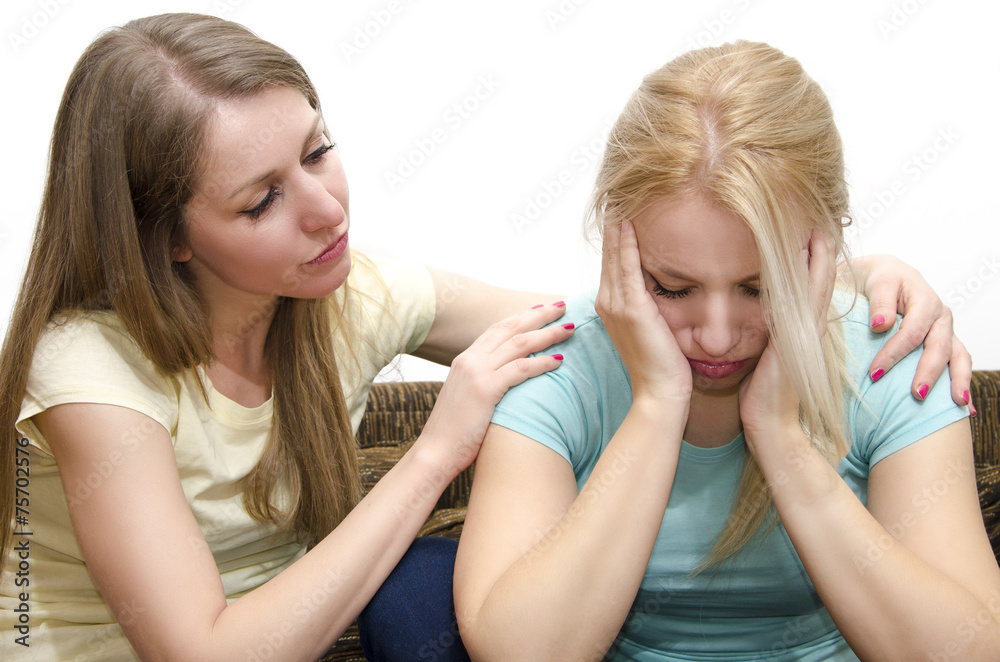 Beautiful young brunette comforting sad friend