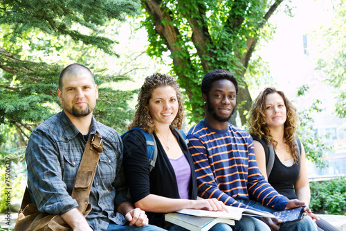 Group of students sitting on bench