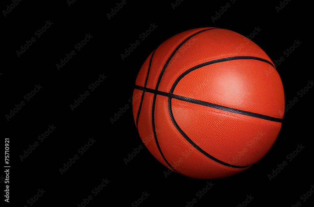 Basketball ball over black background