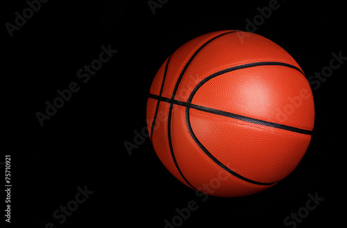 Basketball ball over black background