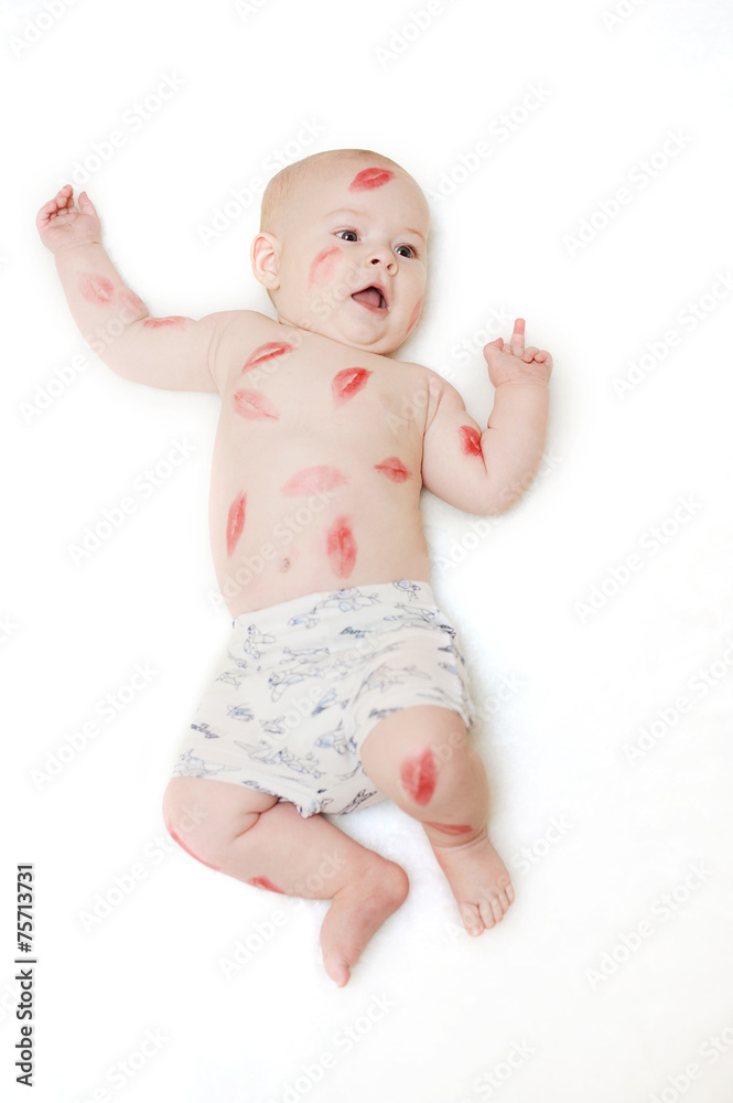 child kissing on a white background showing middle finger child kissing on a white background showing middle finger