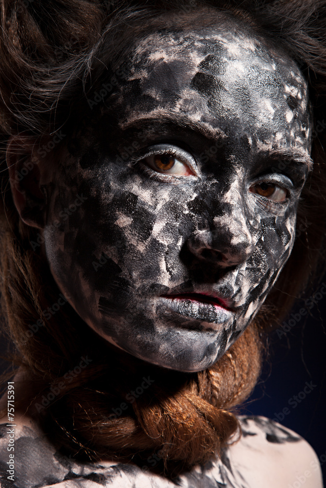 art photo of a beautiful woman with black and white face art