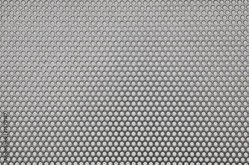 Metal surface with holes, industrial background