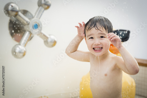 Mixed Race Boy Having Fun a...