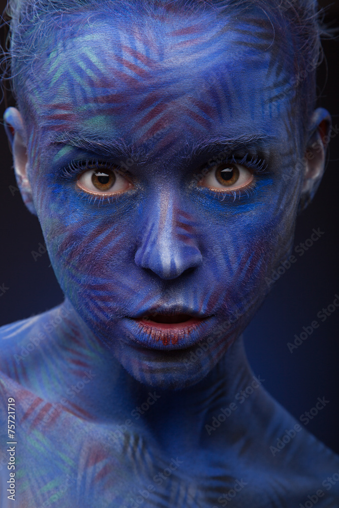 art photo of a beautiful woman with blue face