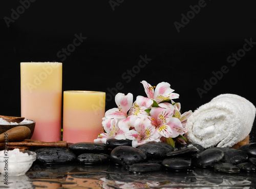 spa concept –orchid and ,candle, towel, salt in bowl, stones
