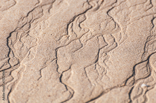 closeup of sand pattern of a beach in the summer thailand