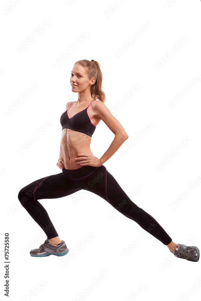 Young beautiful fitness girl doing streching exercise. isolated Young beautiful fitness girl doing streching exercise. isolated