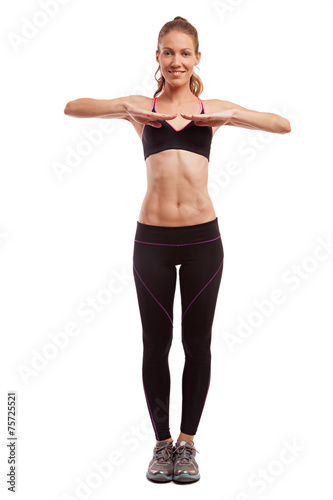 Young beautiful fitness girl doing streching exercise. isolated 