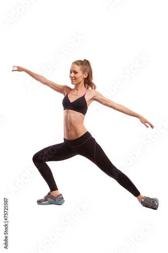Fototapeta Naklejka Na Ścianę i Meble -  Young beautiful fitness girl doing streching exercise. isolated 