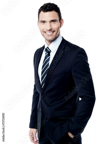 Confident smiling businessman posing