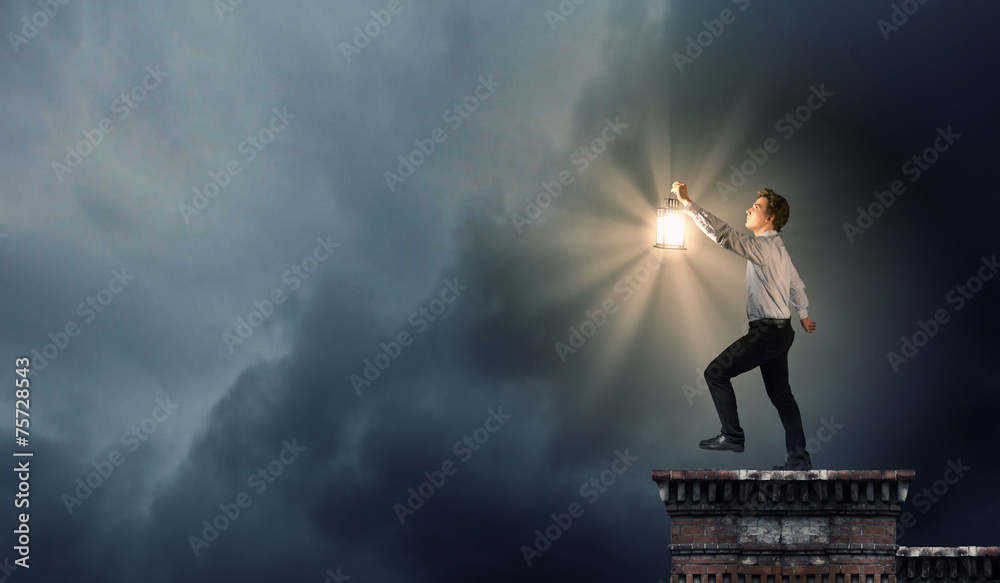 Businessman in search in darkness Businessman in search in darkness