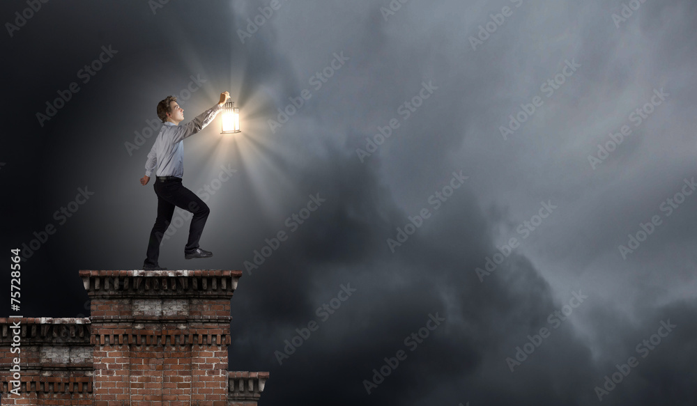Businessman in search in darkness Businessman in search in darkness