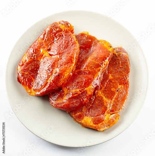 Obraz na plátně Pork neck slices on a plate