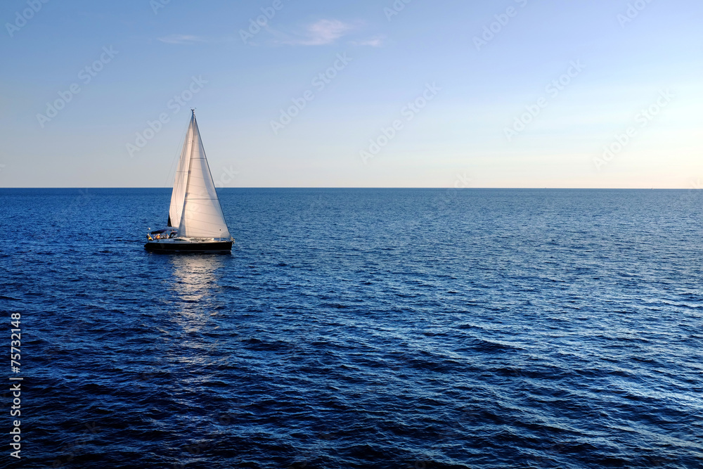 Sail boat on open sea.