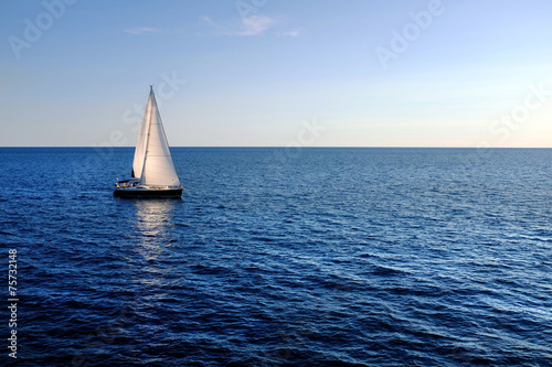 Sail boat on open sea. photo