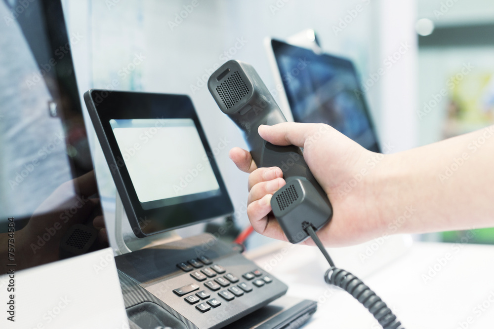 hand using videophone on exhibition. hand using videophone on exhibition.