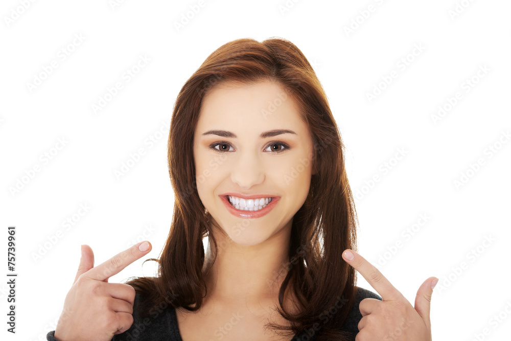 Young woman showing her teeth