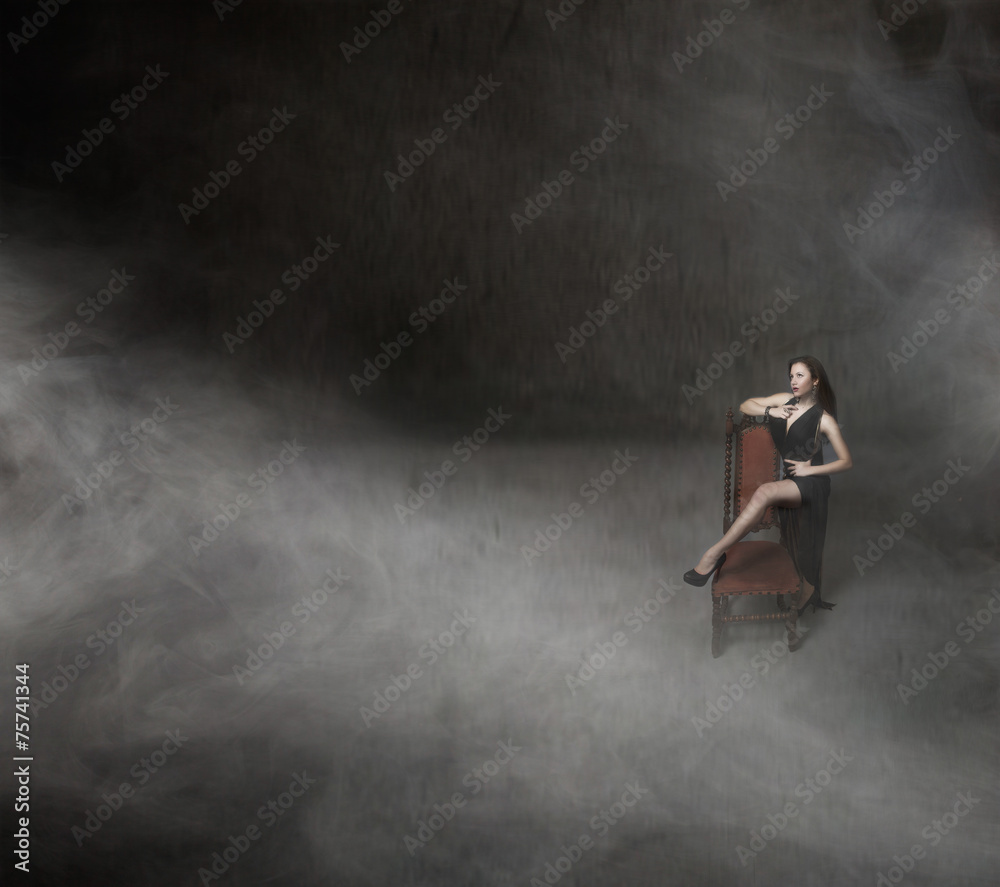 Fototapeta premium nice girl posing with long black dress