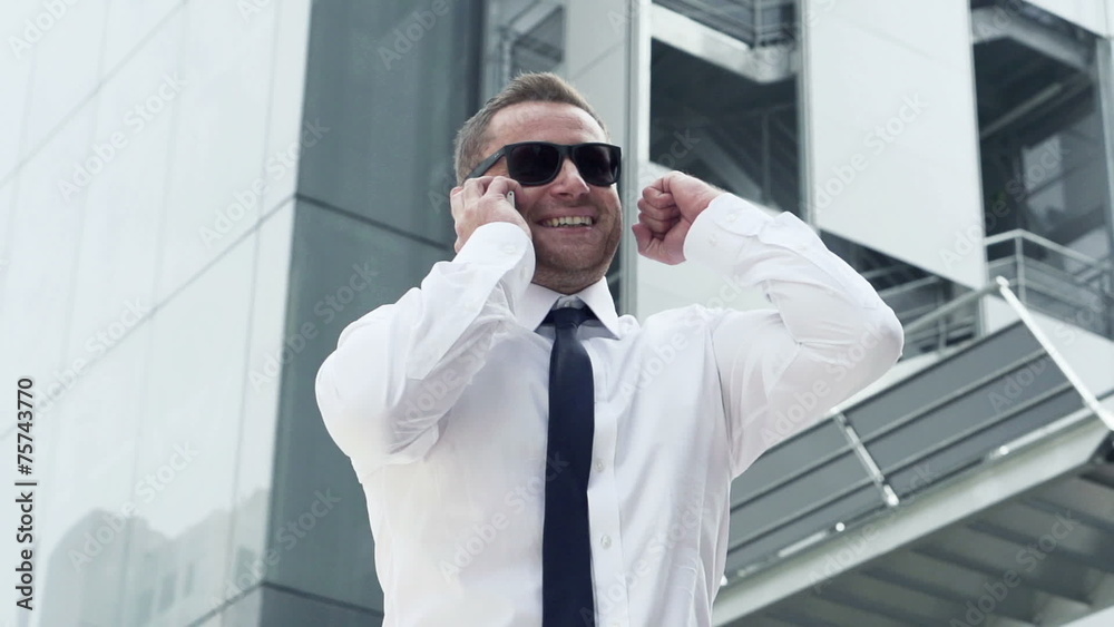Successful, excited businessman with cellphone in the city, Successful, excited businessman with cellphone in the city,
