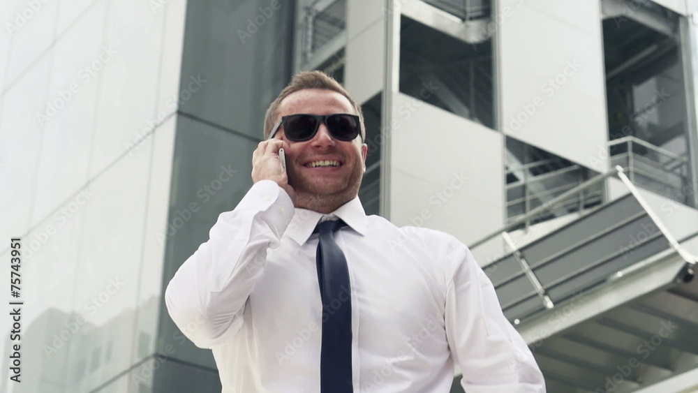 Successful, excited businessman with cellphone in the city, Successful, excited businessman with cellphone in the city,