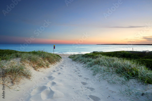 Fototapeta Naklejka Na Ścianę i Meble -  Sandy beach trail at dusk sundown Australia
