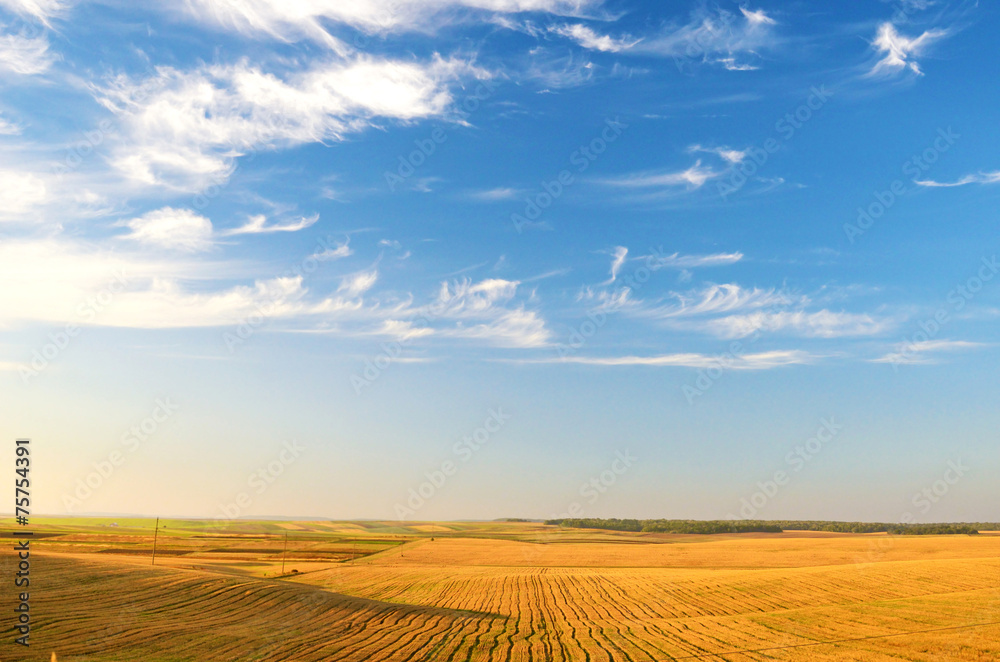 The picturesque landscape of the lines in the field against the The picturesque landscape of the lines in the field against the