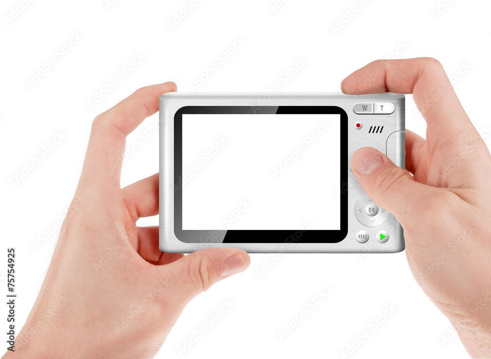 Hand holding a compact digital camera with empty LCD screen