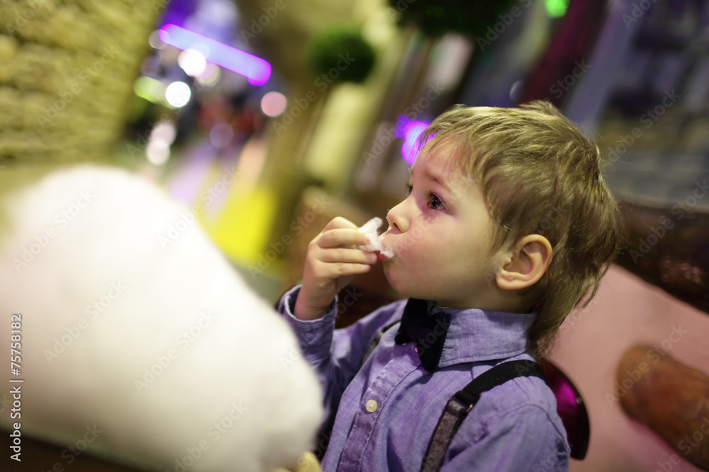 Child eating cotton candy Child eating cotton candy