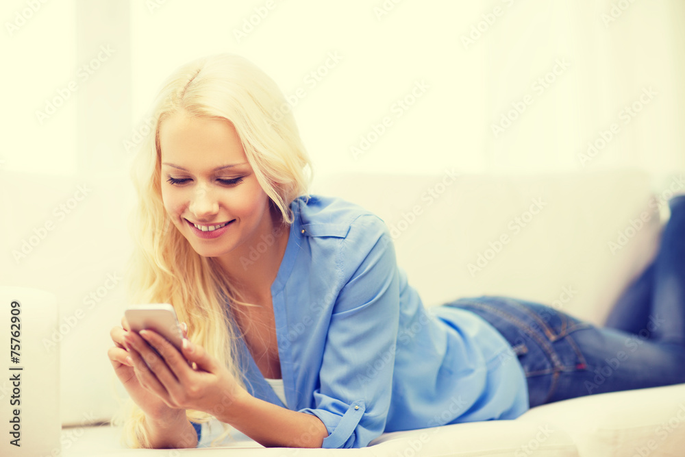 smiling woman with smartphone at home smiling woman with smartphone at home