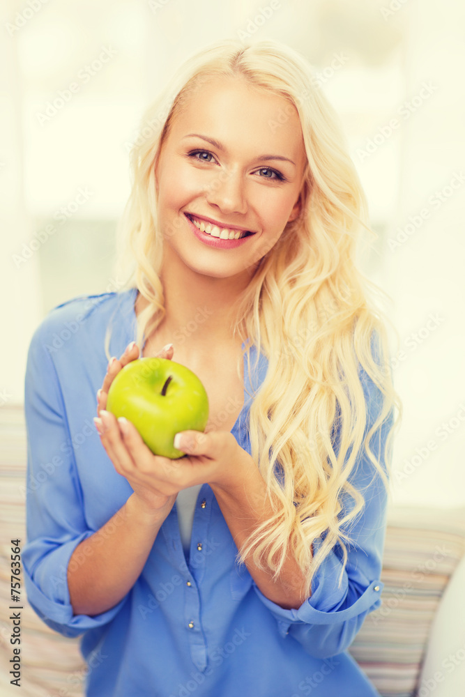 smiling woman with green apple at home smiling woman with green apple at home