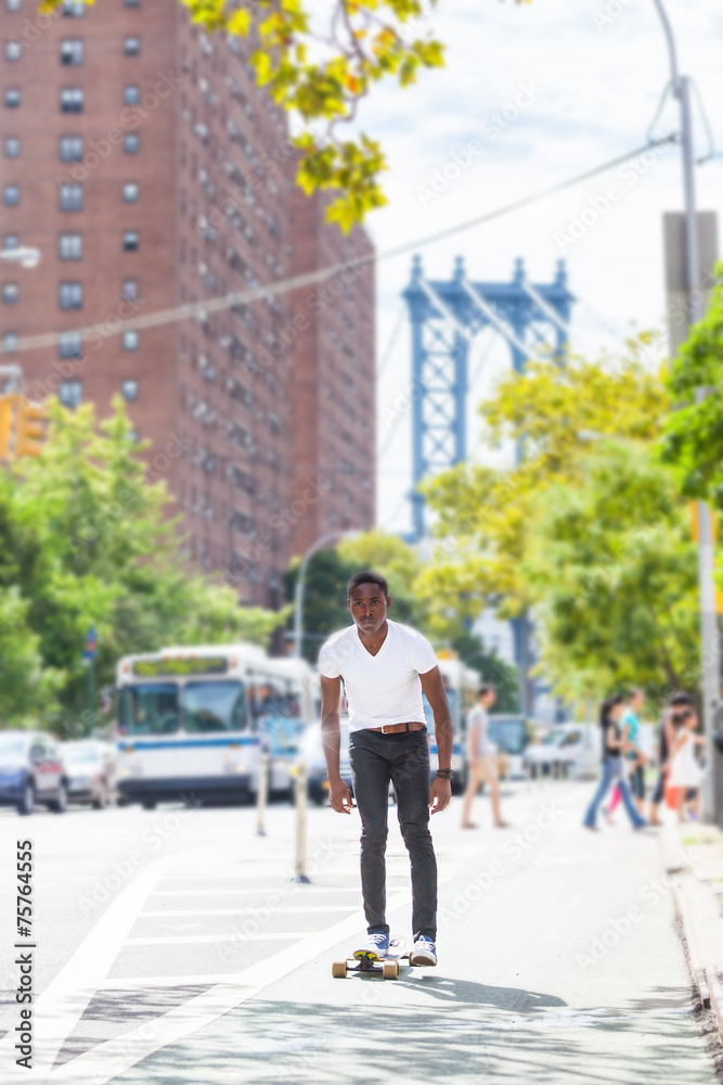 Black Boy Skating with Longboard on the Road Black Boy Skating with Longboard on the Road