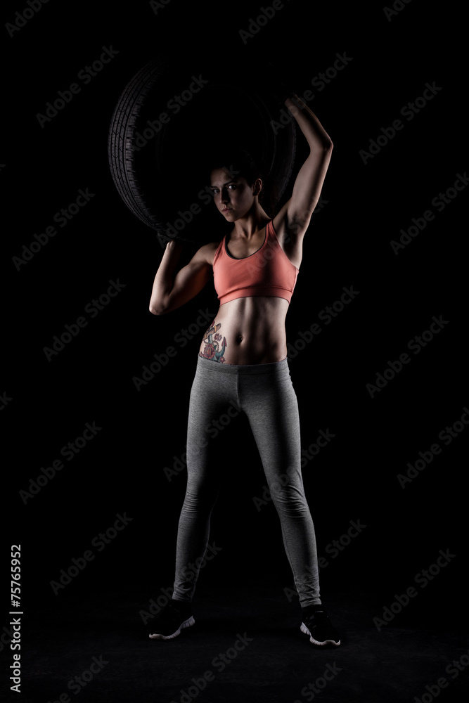 fitness girl with a tyre