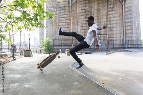 Black Boy Skating at Park and Falling Down photo